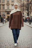 Hijabi model wearing warm brown wool blouse with jeans