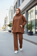 Hijabi woman in honey brown hoodie set street style
