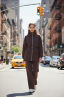 Non-hijabi model in brown set - NYC with traffic lights