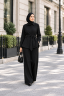 Black pinstripe set with full-body framing and space above the hijab