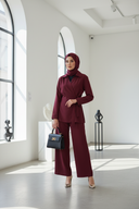 Hijabi model in burgundy set with bag