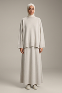 Ivory knit sweater and maxi skirt with the new hijabi model reference
