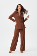 Model in terracotta brown set - white background