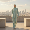 Tall Hijabi Model in Mint Green Set with White Sneakers on Rooftop