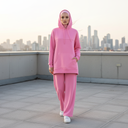 Tall Hijabi Model in Pink Hoodie Set with White Sneakers on Rooftop