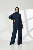 White studio with dramatic shadow